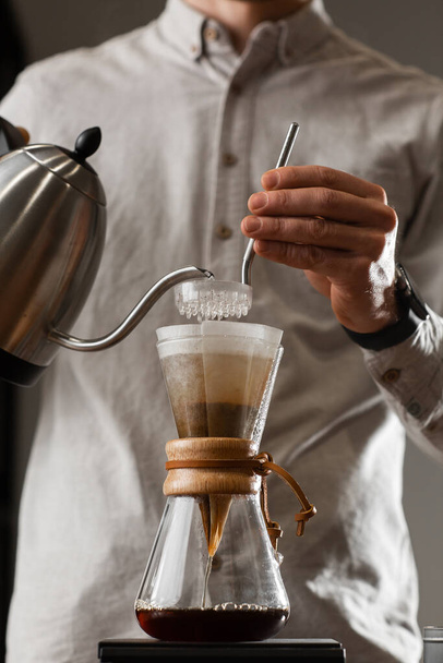 Brewing Pour Over Style of Coffee Making Dripping with Bubbles. Alternative coffee-making methods. Beautiful close up view or preparing morning coffee. Coffee industry. Coffee shop concept - Φωτογραφία, εικόνα