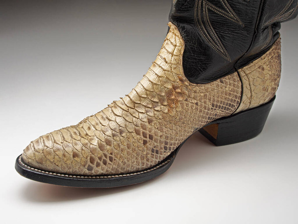 Cowboy boot made from the skin of a short-tailed or blood python (Python curtus). This species occurs in Sumatra and associated islands - Фото, изображение