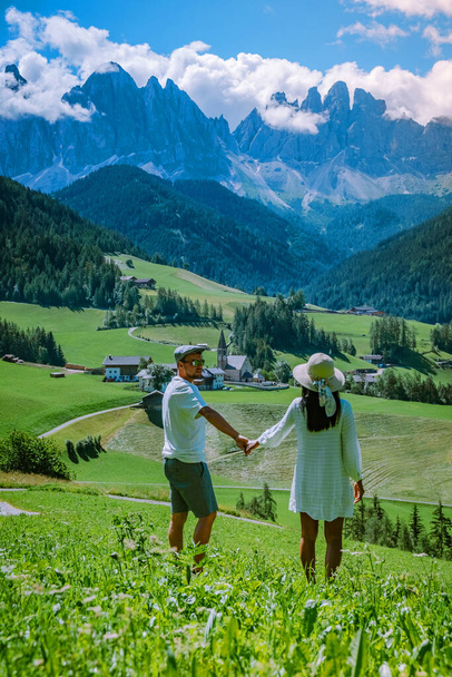 couple on vacation Santa Magdalena Village in Dolomites area Italy, couple on vacation Val Di Funes Italian Dolomites - Foto, afbeelding