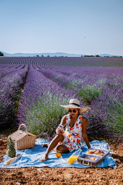 woman on vacation at the provence lavender fields, Provence, Lavender field France, Valensole Plateau, colorful field of Lavender Valensole Plateau, Provence, Southern France. Lavender field - Photo, Image