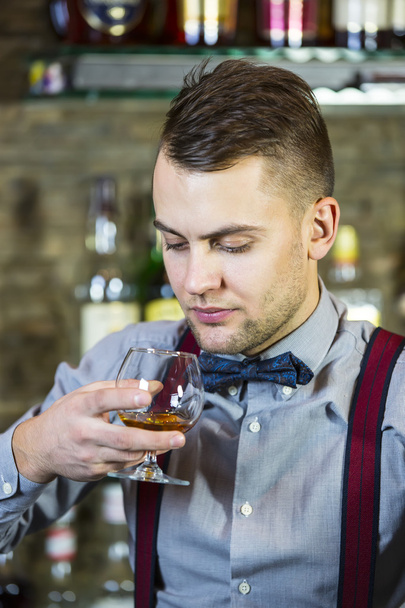 Young man working as a bartender - Photo, image