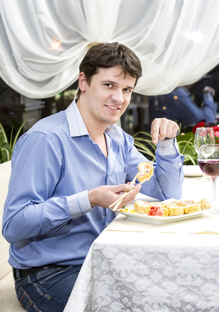 Young man having dinner - Foto, Bild