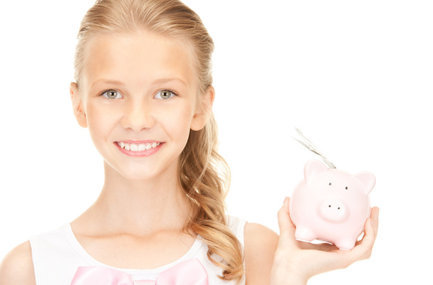 Lovely teenage girl with piggy bank and money - Foto, imagen