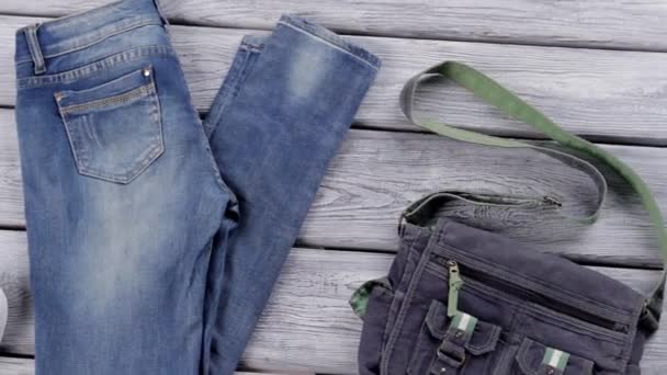 blue jeans and white shoes classic rubber shoes and bag new arrivals in jeans shop - Footage, Video
