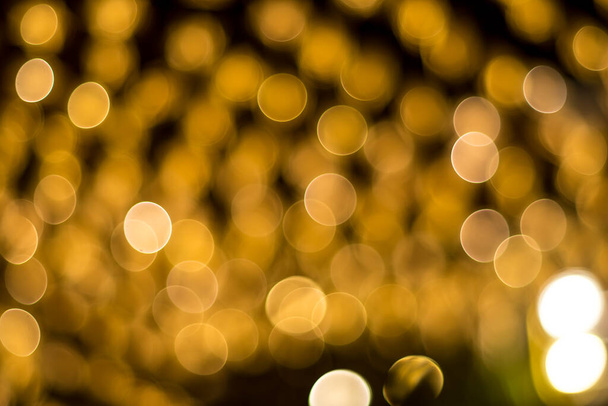 The background of beautiful glowing golden bokeh. - Zdjęcie, obraz