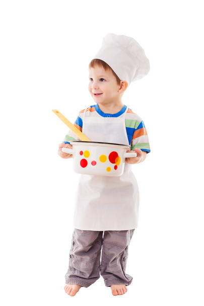 Little cook standing with ladle and pan - Valokuva, kuva