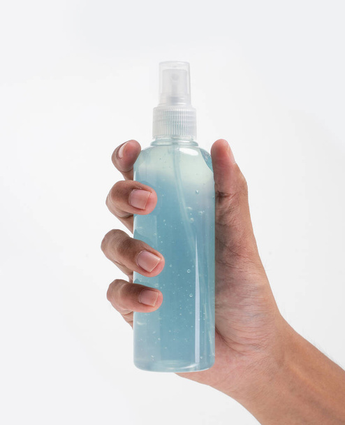 hand holding plastic bottle hand sanitizer mockup - Fotografie, Obrázek