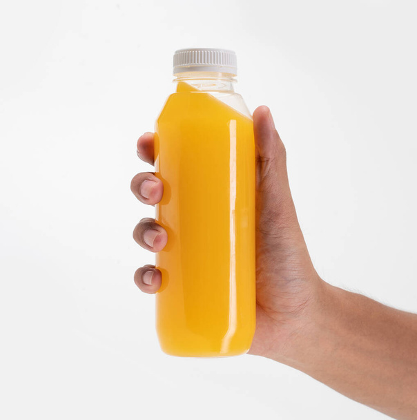 hand holding beverage product on plastic bottle mockup - Valokuva, kuva