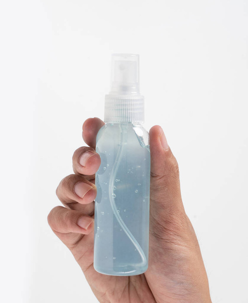 hand holding plastic bottle hand sanitizer mockup - Foto, Imagem