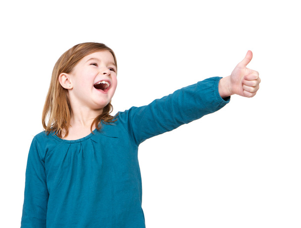 Молода дівчина сміється з великими пальцями вгору
 - Фото, зображення