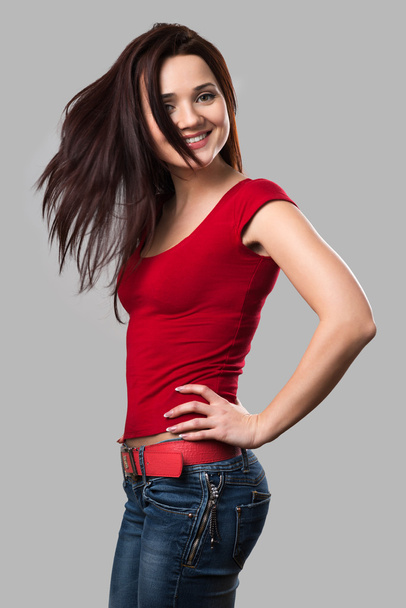 beautiful cheerful girl with fluttering hair - Фото, зображення
