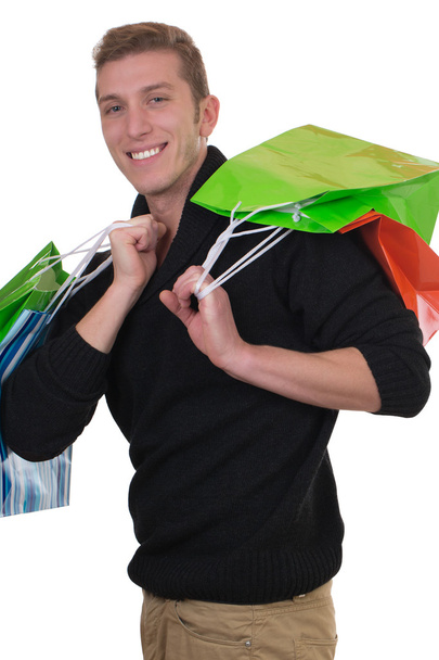 Young man with shopping bags - Fotó, kép