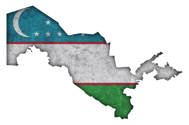 Karte und Flagge Usbekistans auf verwittertem Beton - Foto, Bild
