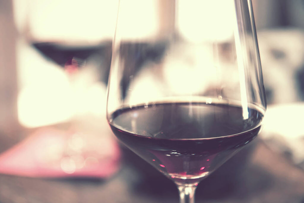 glass of red wine vintage effect, closeup of alcoholic beverage - Photo, Image