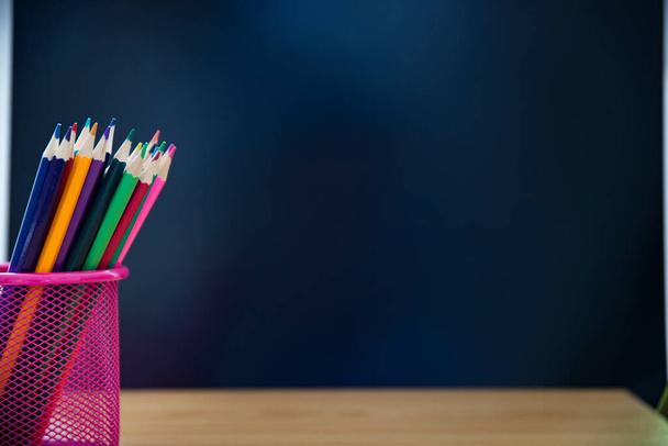 Back to school concept.Colorful pencils on chalkboard background. - Zdjęcie, obraz