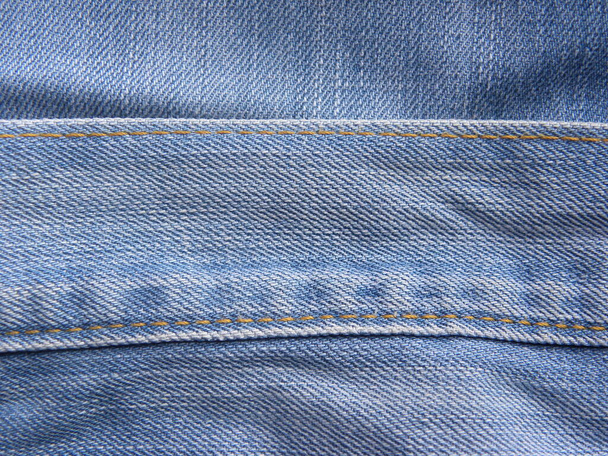 Зв'язаний шов пояса смуги світло-блакитного кольору джинси
 - Фото, зображення