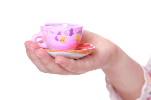 Toy cup in hand - Φωτογραφία, εικόνα
