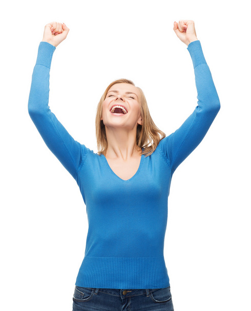 Laughing young woman with hands up - Photo, Image