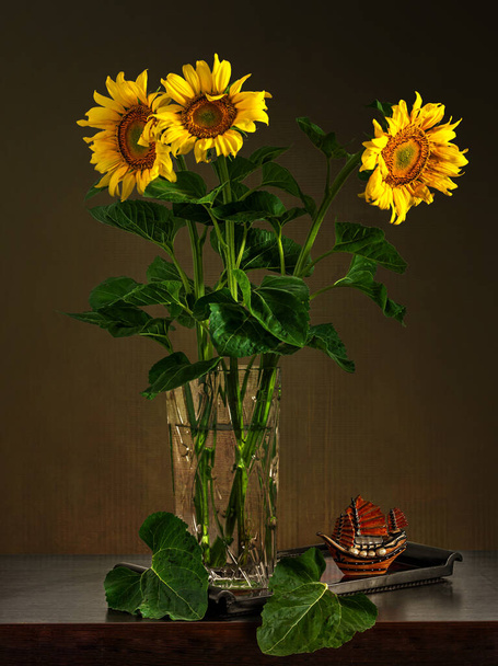 Still life with a bouquet of beautiful sunflowers. Vintage. - Foto, imagen
