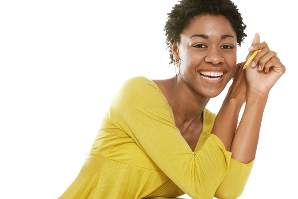 Portrait of Beautiful black african american woman wearing yellow top - Фото, зображення