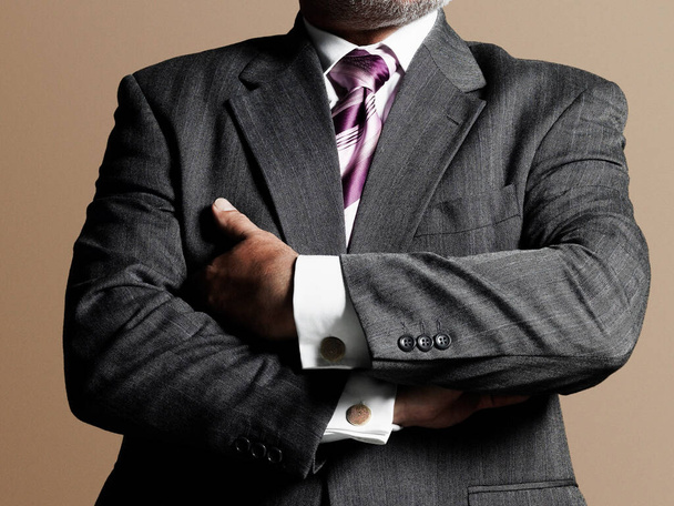 Male business man in suit with arms folded - Foto, immagini