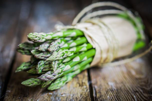 Asparagus on rustic wooden background - Фото, изображение