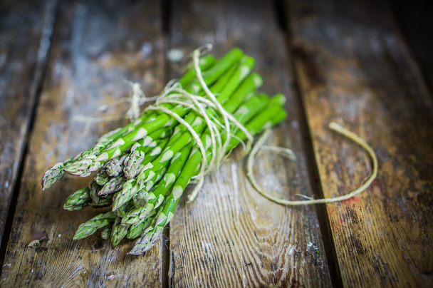 Asparagus on rustic wooden background - Foto, Imagem