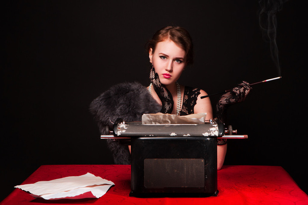 The beautiful girl at a typewriter - Photo, image