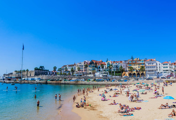 View of the Praia dos Pescadores beach and downtown in Cascais, Portugal, on a sunny day. - Photo, Image