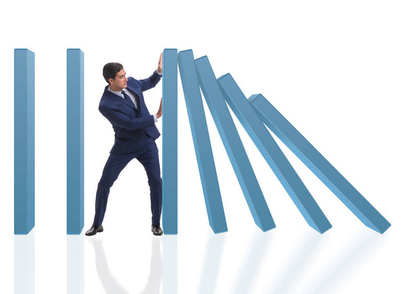 Uomo d'affari nel concetto di business effetto domino - Foto, immagini
