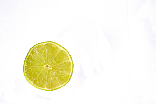Lime on a white background - Фото, изображение