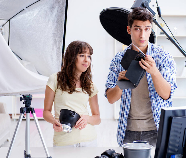 Young photographer working in photo studio - Photo, Image
