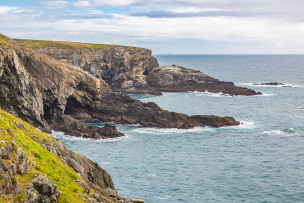 Rough cliff line at Mizen head lighthouse in southern west Ireland - Photo, image