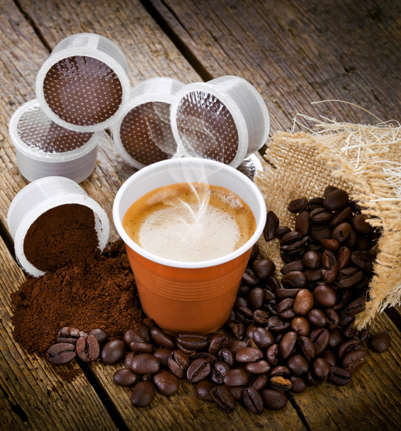 Espresso coffee in disposable cup with pods - Photo, Image