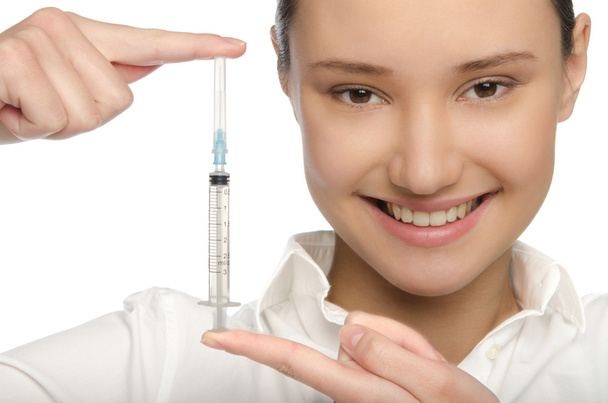 Young doctor shows a syringe - Foto, Bild