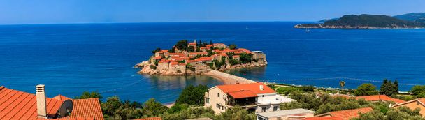 Picturesque panoramic view of the Sveti Stefan luxury resort island on the Adriatic sea coast near Budva, Montenegro - Photo, Image