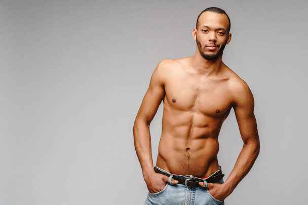 Sexy young muscular african american man shirtless over light grey background - Φωτογραφία, εικόνα