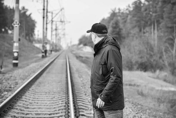 Senior man thinking about his life on Railway, Mature man psychology - Fotoğraf, Görsel