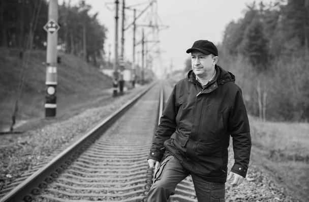 Senior man thinking about his life on Railway, Mature man psychology - Photo, Image