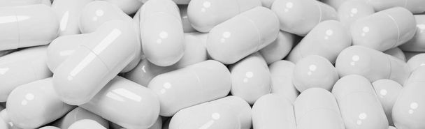 Close up of many white pills capsules. Medicine and pharmacy concept.,3d model and illustration. - 写真・画像