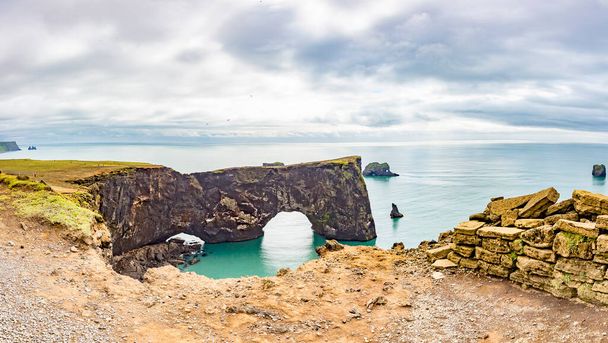 View on natural arches at Reynisfjara black beach in southern Iceland in summer - 写真・画像