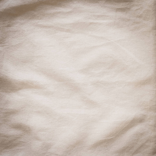 Pamuk muslin kumaş dokusu arka plan çuval bej rengi eski kahverengi sepia kumaş duvar kağıdı ve tasarım için doğal hafif kumaş. - Fotoğraf, Görsel