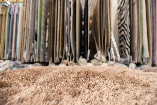Carpets assortment on the store counter close up abstract background. - Φωτογραφία, εικόνα