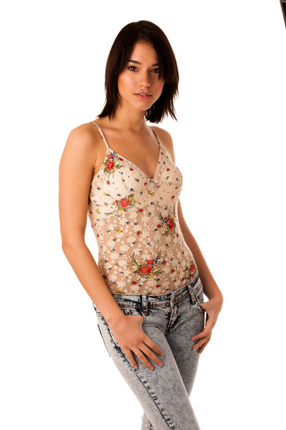 Beautiful asian caucasian woman in jeans and short summer shirt - Фото, изображение