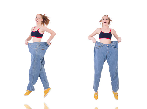 Woman with large jeans in dieting concept - Fotografie, Obrázek
