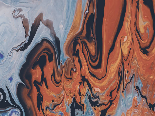 A beautiful shot of orange and blue shaded fluid painting background - Фото, зображення