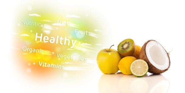 Colorful juicy fruits with healthy text and signs - Foto, Bild