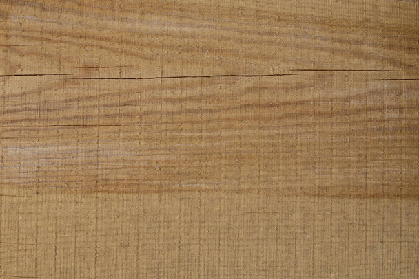 Background of freshly cut brown wooden boards with cracks. Horizontal stripes. - Photo, Image