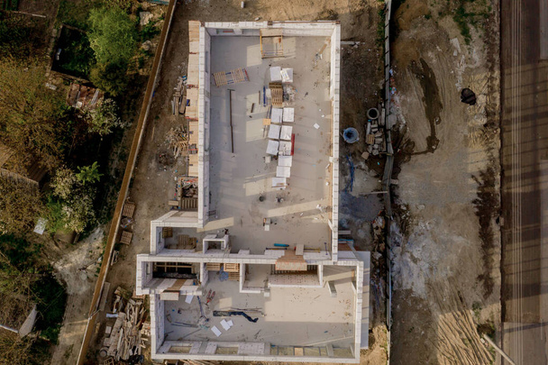 Building site of a house under construction made from white foam concrete blocks. Building new frame of home. - Photo, Image