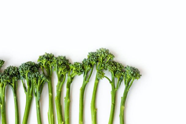 Fresh broccolini isolated on white background with copy space - 写真・画像